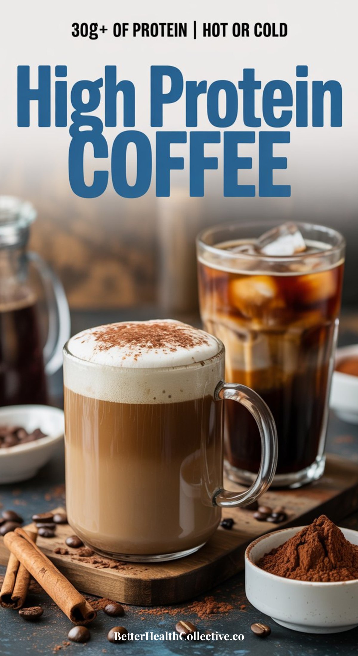 A glass mug of frothy high protein coffee sits on a table beside iced coffee, coffee beans, cinnamon sticks, and a jar of ground coffee. Text above reads 30g+ of protein | Hot or Cold. High Protein Coffee.