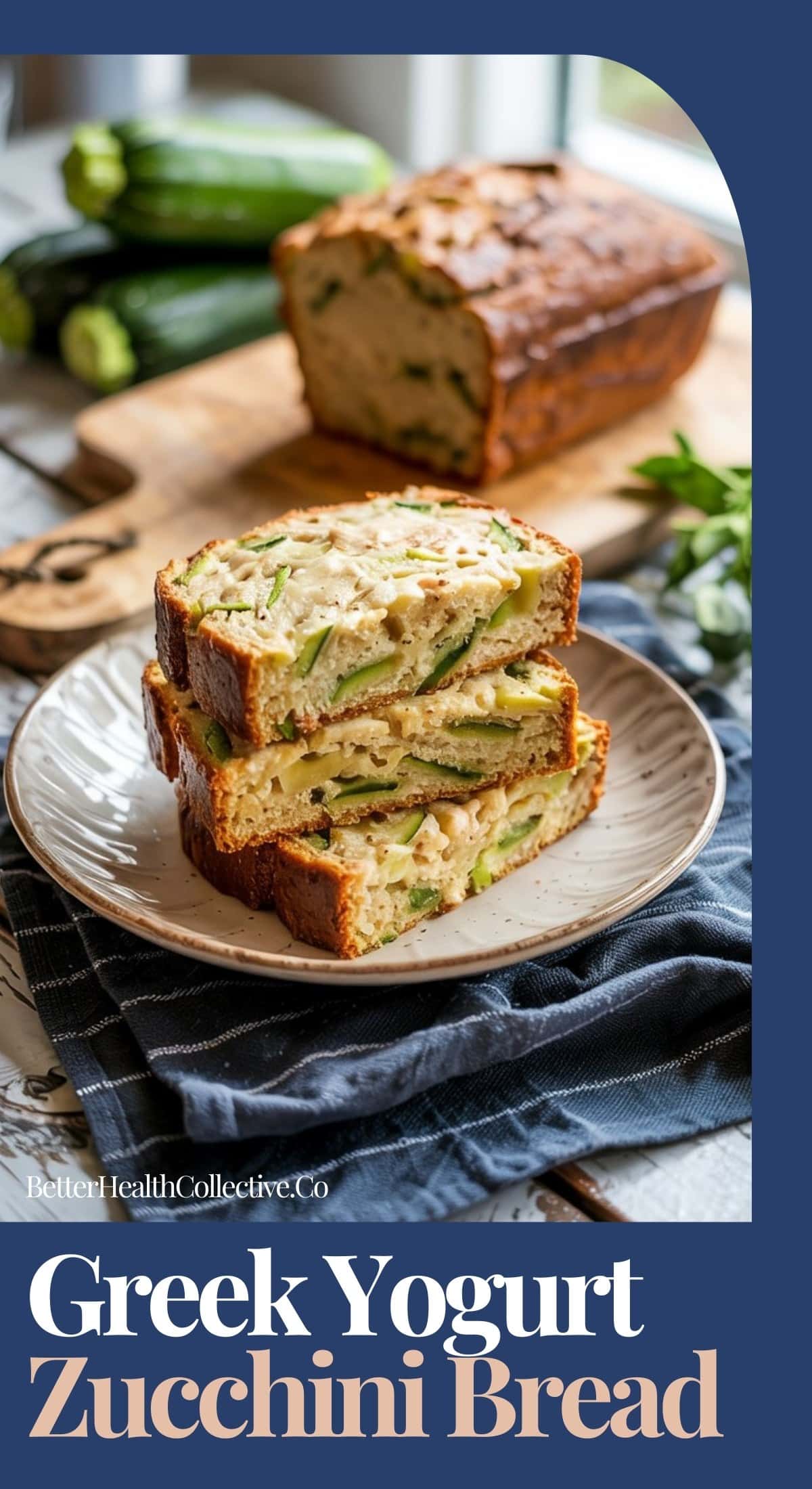 A plate with three slices of Greek yogurt zucchini bread sits in front of a loaf on a wooden board. Fresh zucchini and herbs are in the background. Text reads: Greek Yogurt Zucchini Bread.