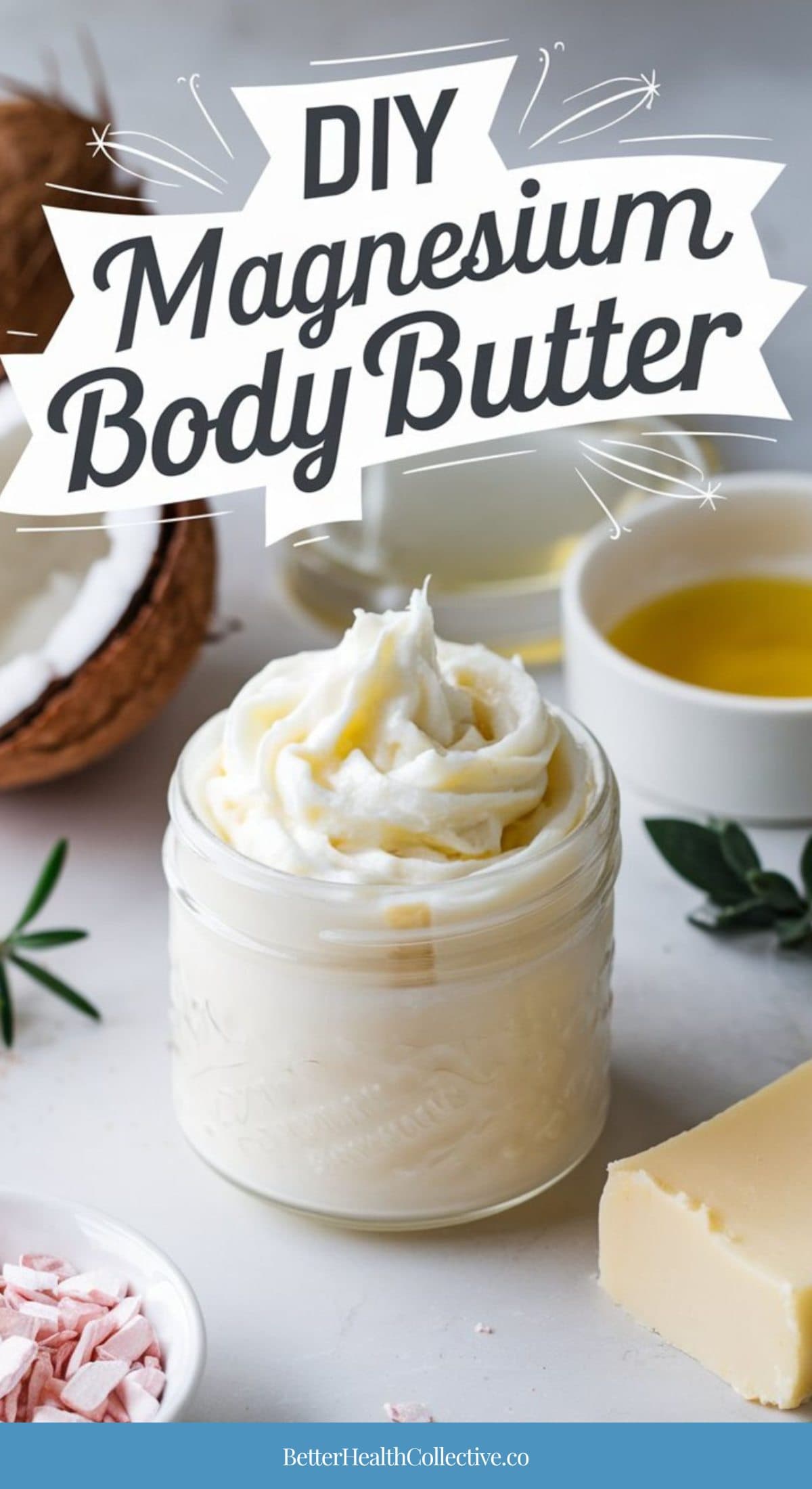 A jar of whipped magnesium body butter sits on a white surface, surrounded by coconut, oil, a bowl of yellow liquid, a block of butter, pink salt, and green leaves. The text reads “DIY Magnesium Body Butter.” Perfect for nourishing your skin.