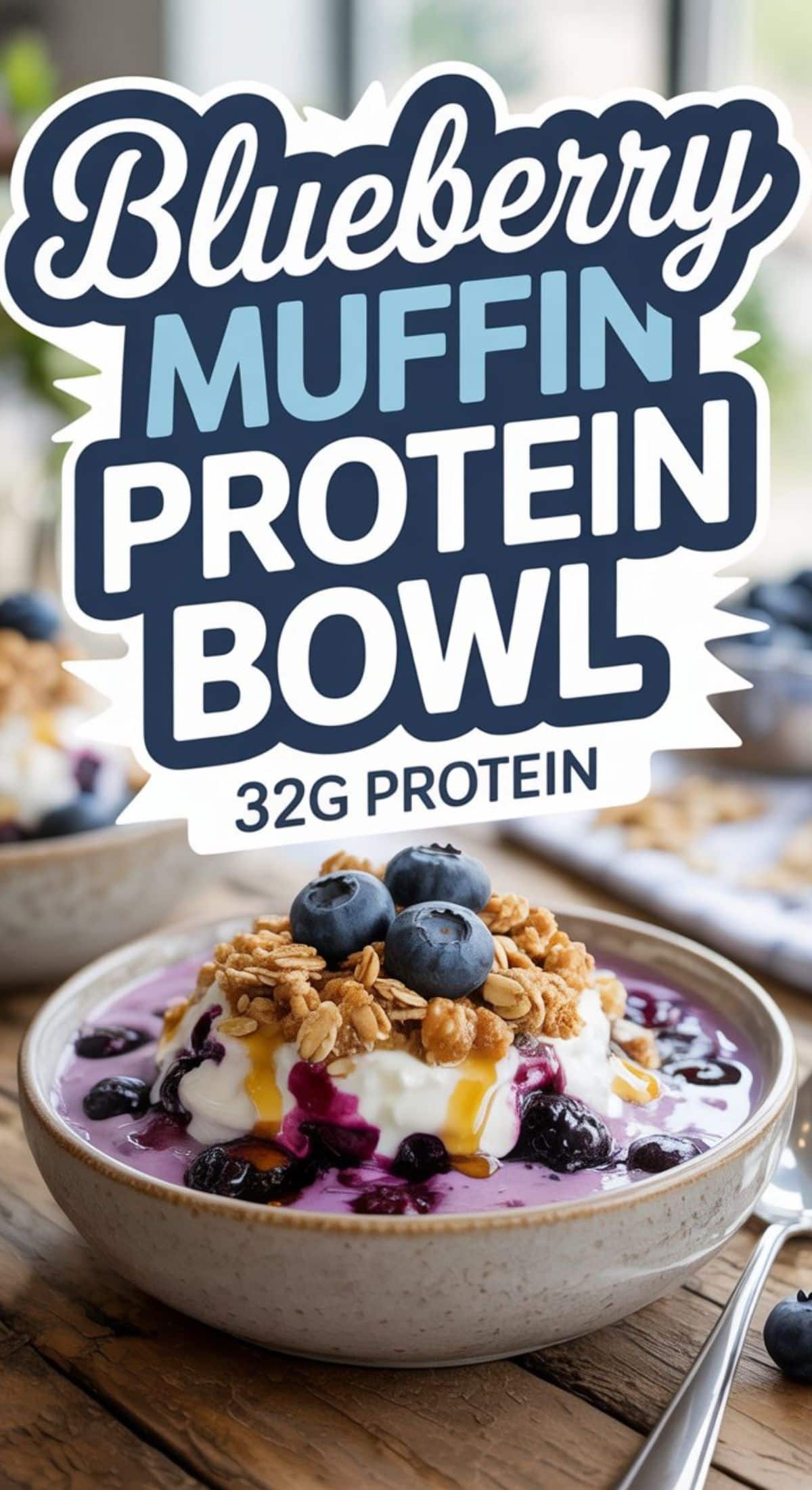 A bowl of yogurt topped with blueberries, granola, and honey sits on a wooden table, with "Blueberry Muffin Protein Bowl, 32g Protein" above it and another blueberry muffin protein bowl blurred in the background.