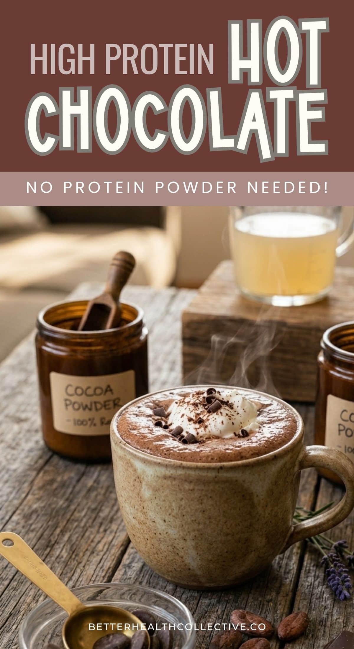 A mug of steaming Bone Broth Hot Chocolate topped with cocoa powder sits on a wooden table, surrounded by jars labeled “Cocoa Powder.” The text above reads “High Protein Hot Chocolate - No Protein Powder Needed!”.